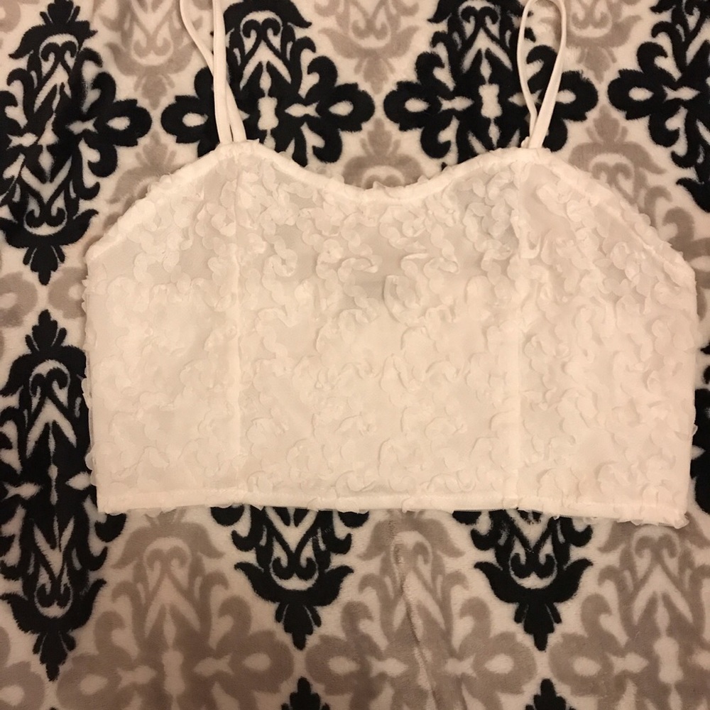 Detailed white crop tank.